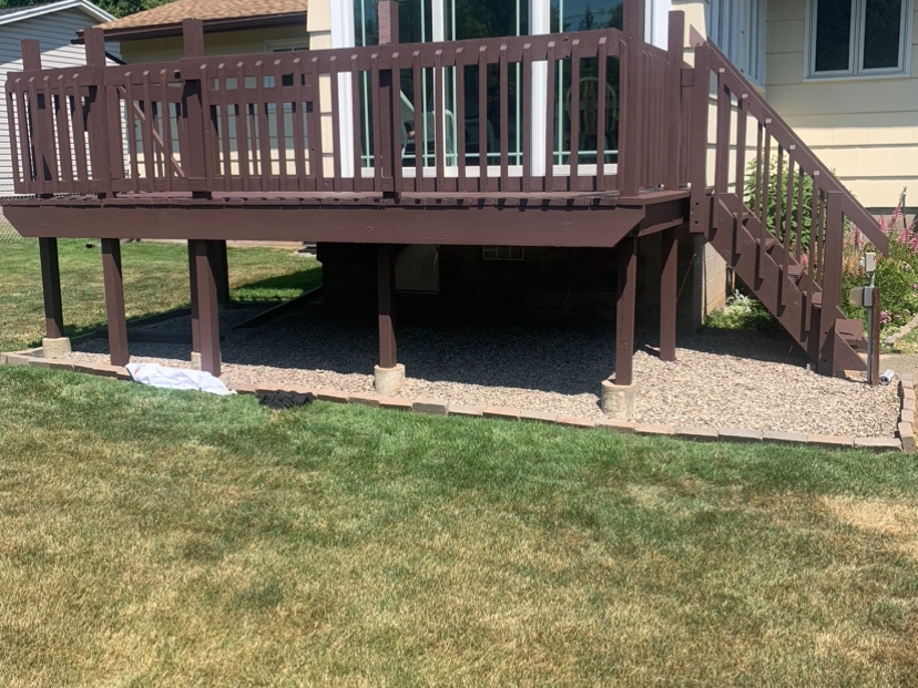 Elevated deck staining attached to residential home