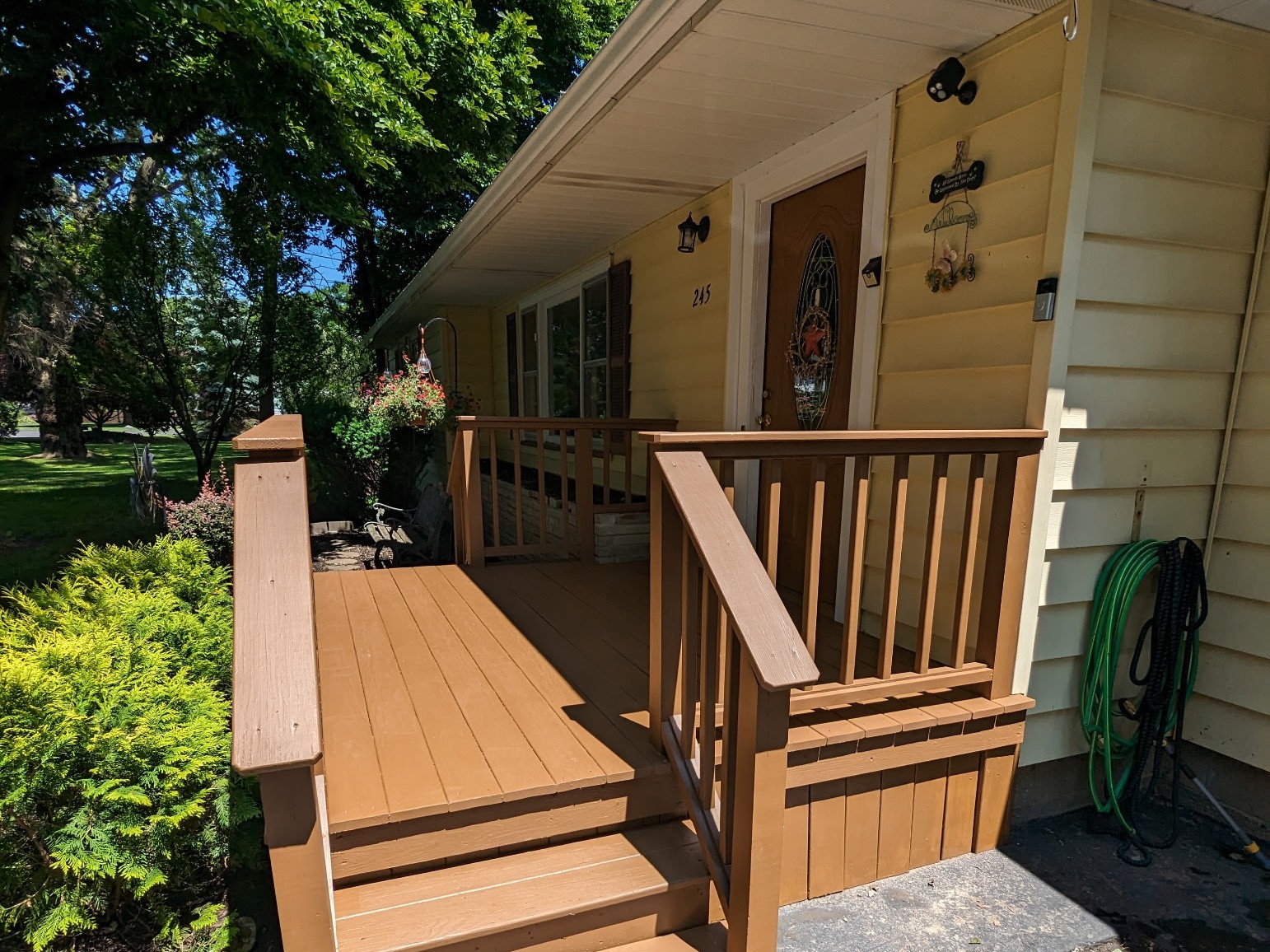 Front porch and stair staining at residential entrance
