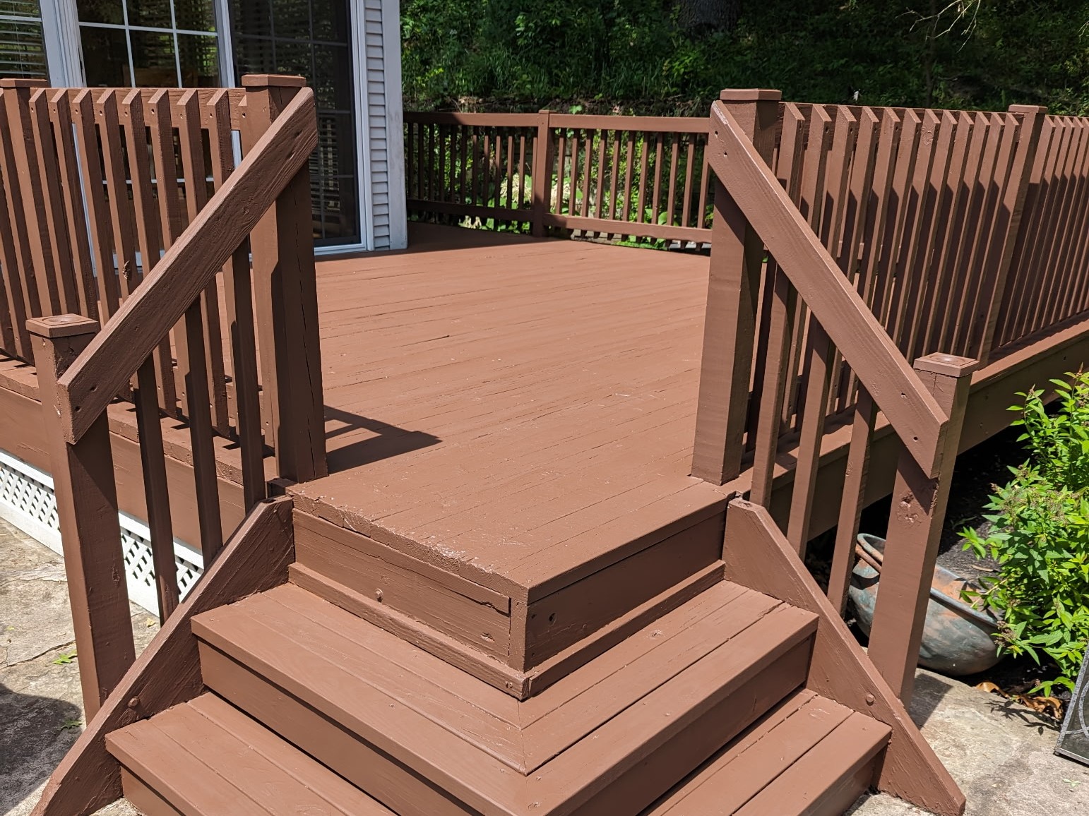 Deck stairs and railing with professional stain coating